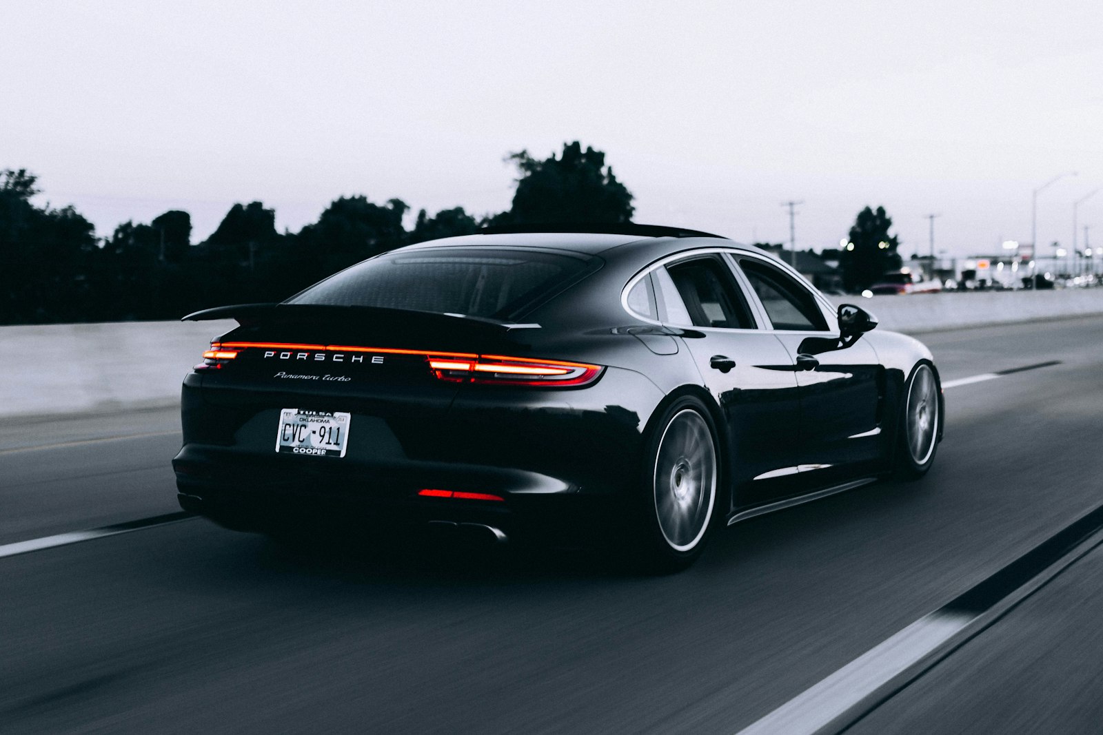 Rebuilt kananvalet.com hero concept: black luxury car at dusk